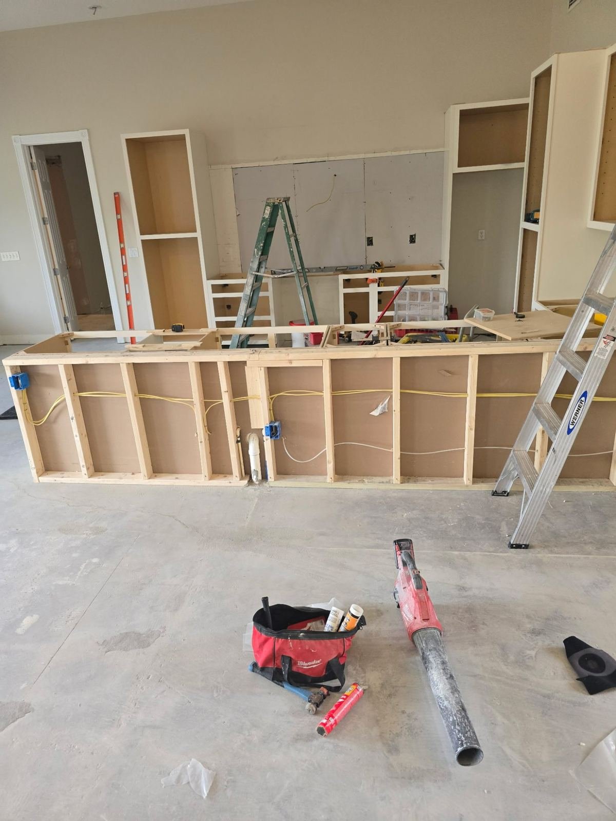 Kitchen during renovation with framing and cabinet installation Fort Myers FL